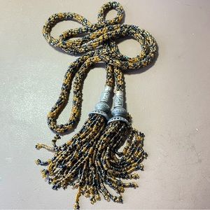 Tortoise colored beaded tasseled rope lariat necklace with tribal silver